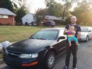 Joshua and baby-Luna Taylor with their car
